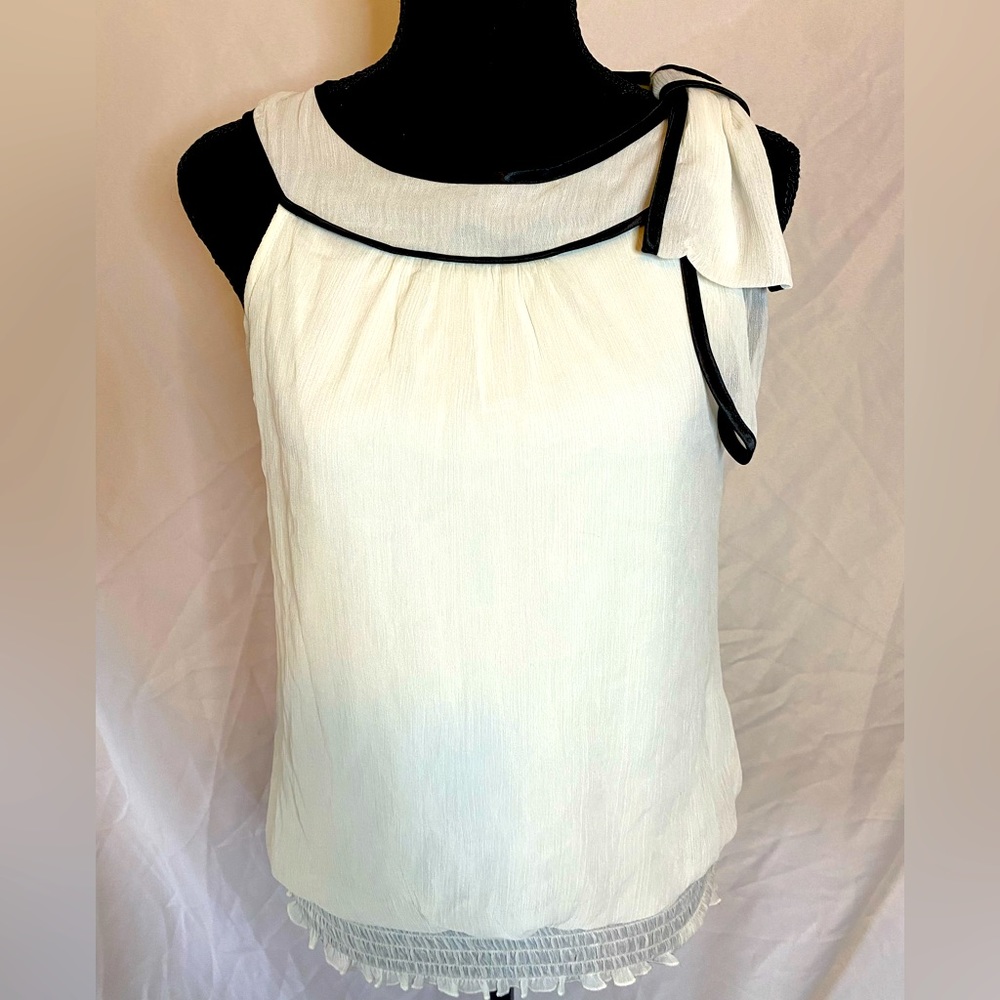 Ivory sleeveless top with black border